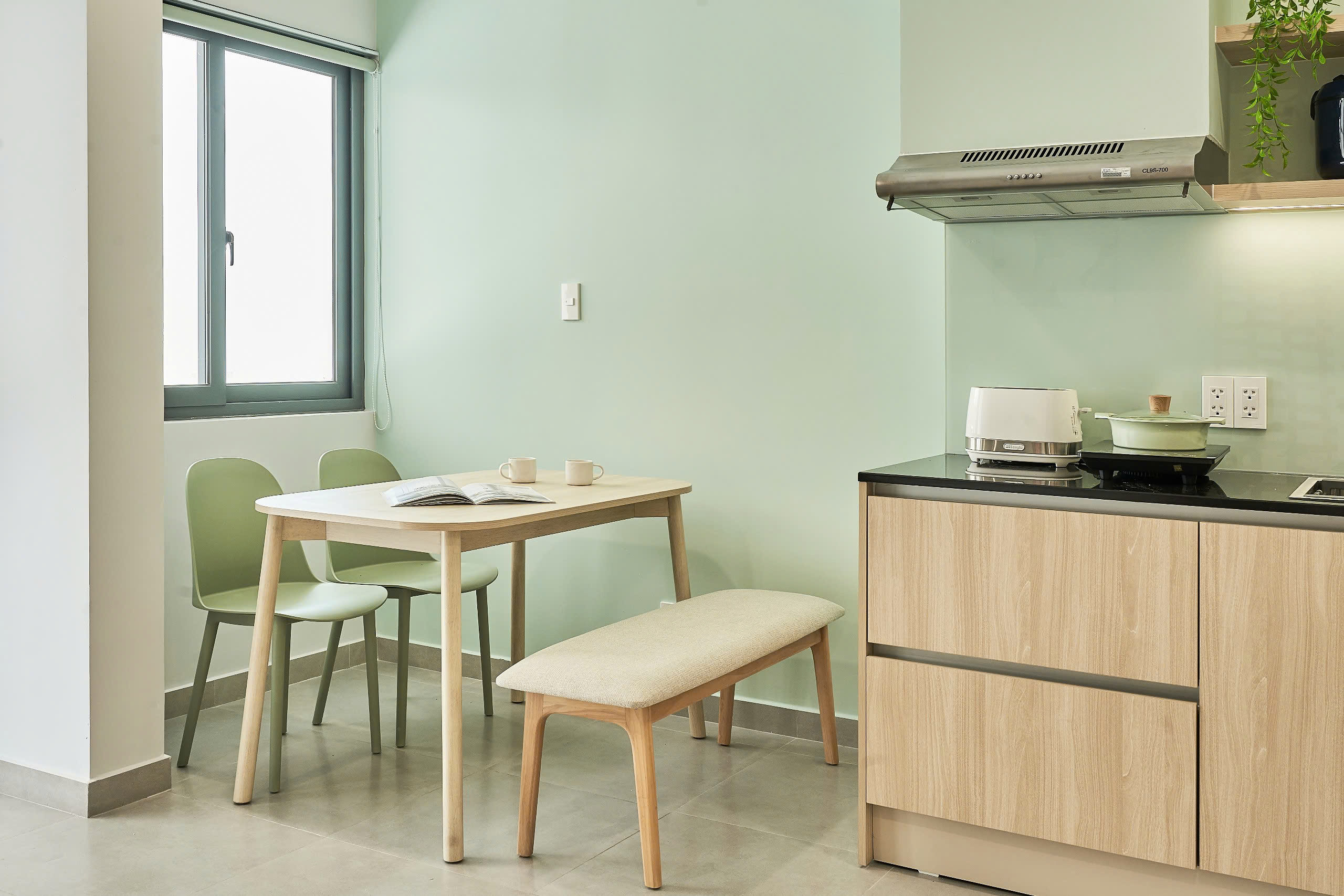 Dining corner and kitchenette at ORA Binh Duong